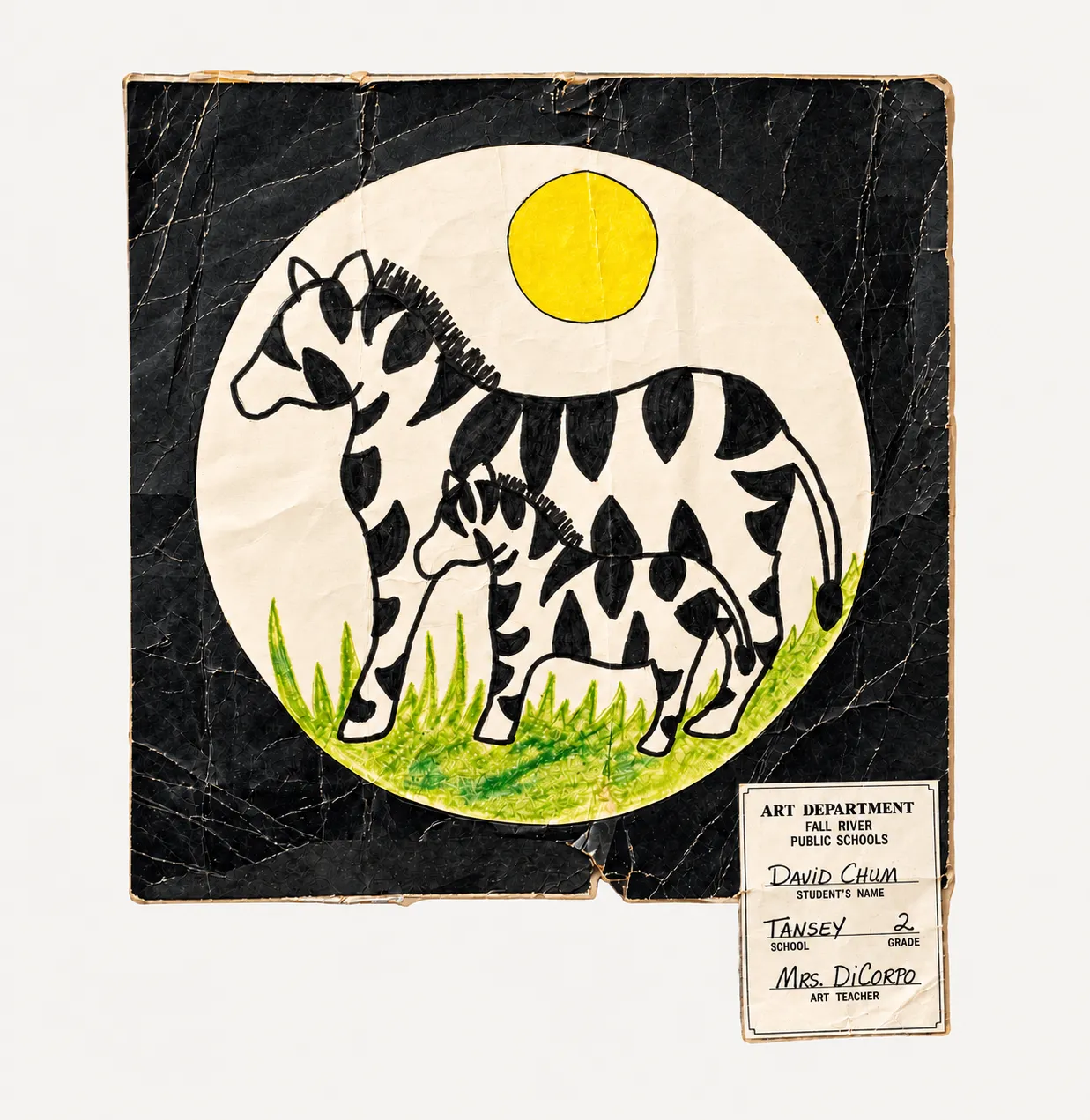 David's second-grade drawing — a zebra and her foal under a yellow sun on cracked black paper, its label reading Art Department, Fall River Public Schools, David Chum, Tansey, grade 2, Mrs. DiCorpo